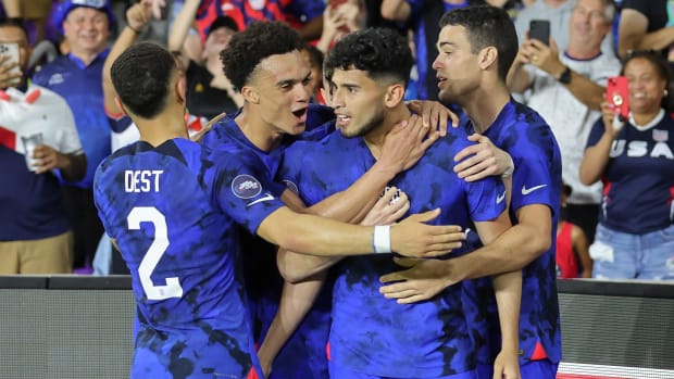The USMNT celebrating a goal